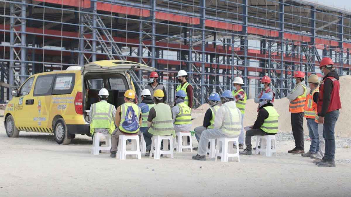 Aramco contractors watch safety training videos from the Safety Training Taxi in the Maritime Yard Development Project