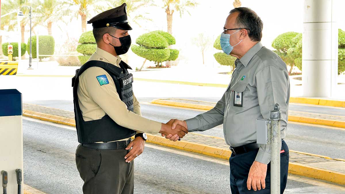 President and CEO Amin Nasser talks with a security guard in Abqaiq.