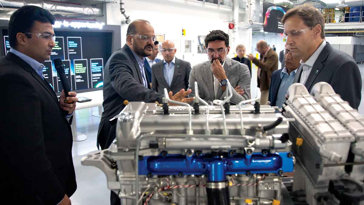 Yasir O. Al-Rumayyan and Ahmad O. Al-Khowaiter examine engine technology at the Detroit Aramco Research Center