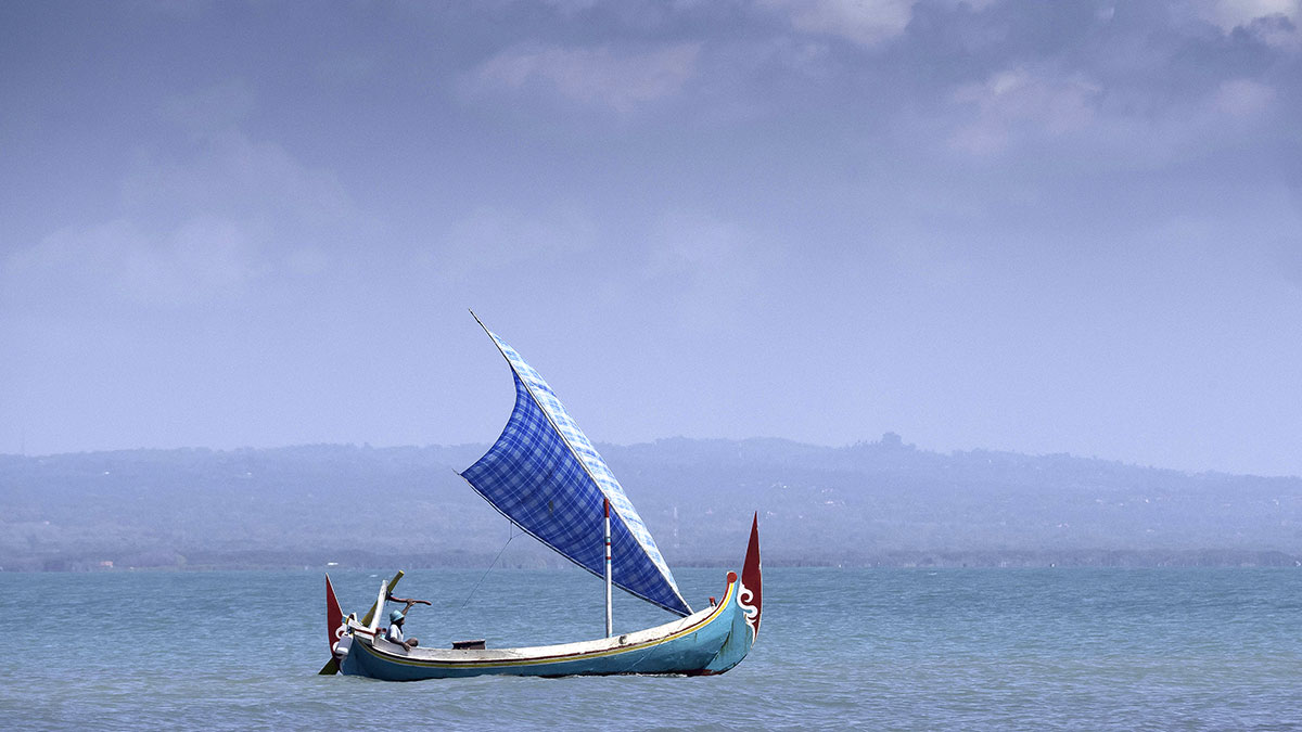 Indonesia Travel HERO of sailboat on Pojuk Padike Beach