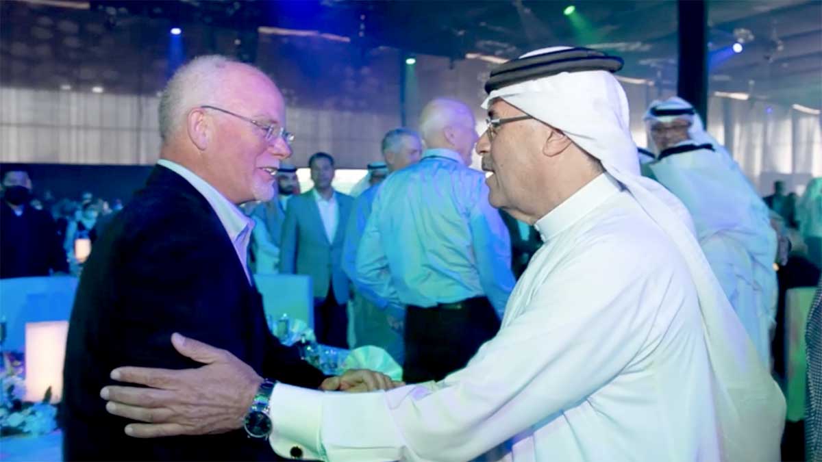 Aramco president and CEO Amin Nasser shakes hands with retiree Mel Knotts at a gathering of expatriate and Saudi retirees on March 2