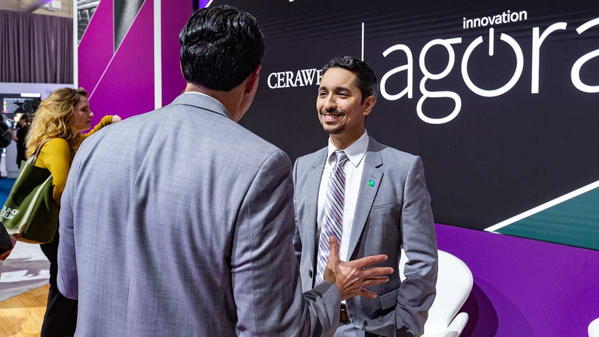 CERAWeek 2023 Mahdi Adel talks with visitor